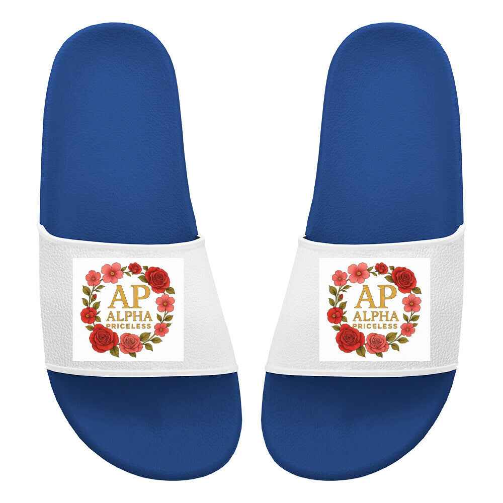 Slide Sandals - Alpha Priceless Signature Slides mit blauem Fußbett und floralem Logo-Design.