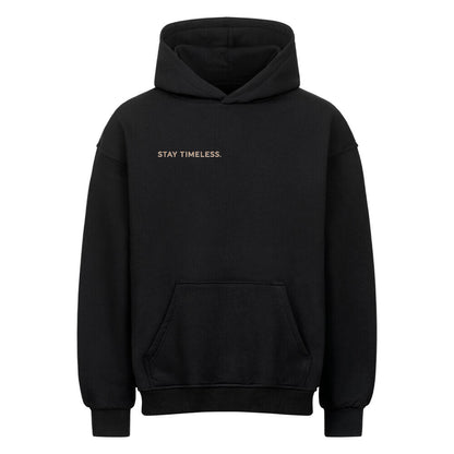 VACANCY Stay Timeless Oversized Hoodie in black with gold text "STAY TIMELESS."