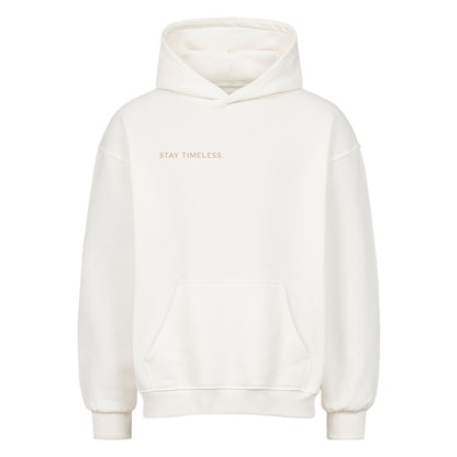 VACANCY Stay Timeless Oversized Hoodie in cream with 'STAY TIMELESS.' print and relaxed fit.