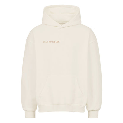 VACANCY Stay Timeless Oversized Hoodie in cream color with Stay Timeless text on the front.